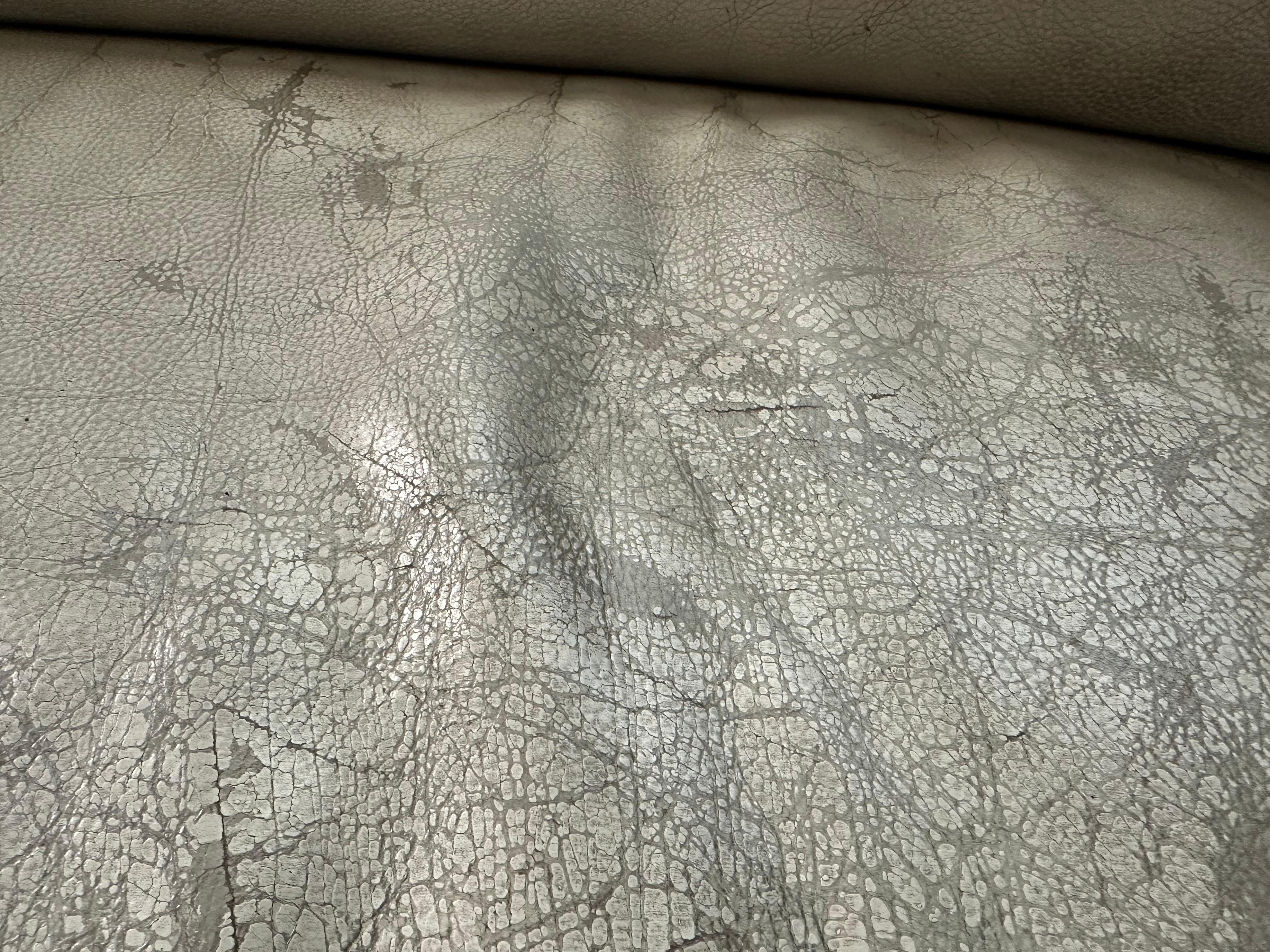 Uncomfortable couch due to cracks and stains