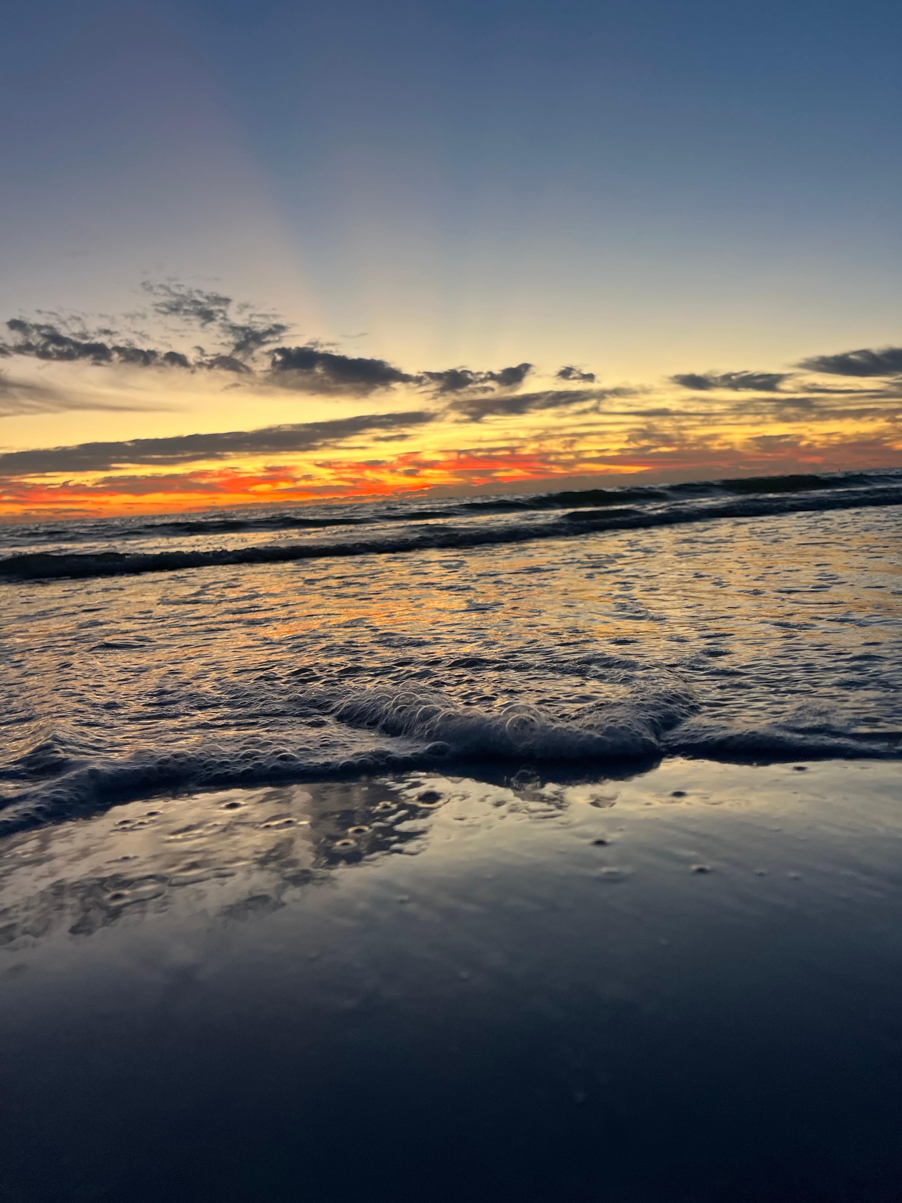 Standing on the beach.
