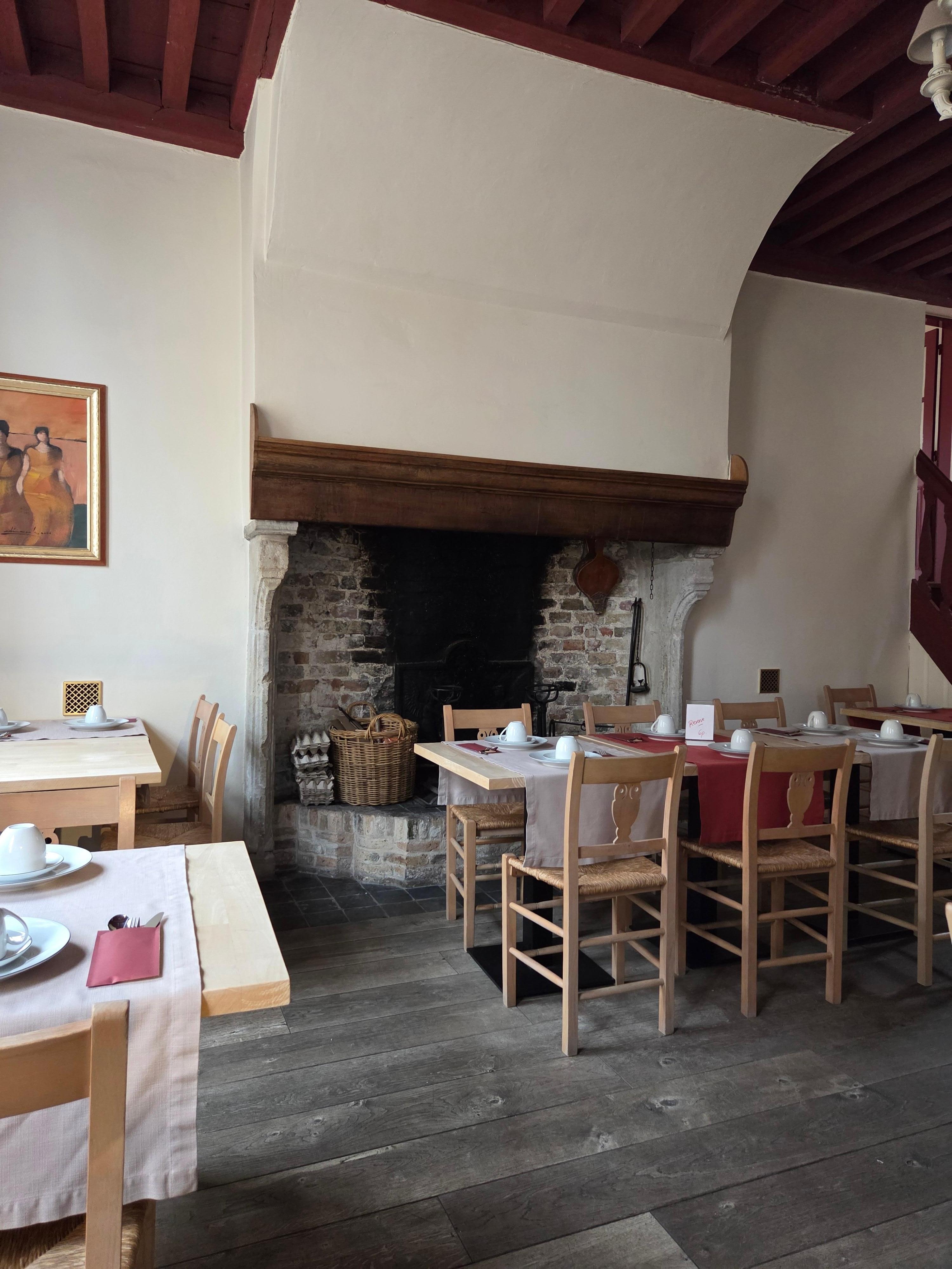 The fireplace in tne breakfast room. 