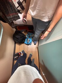 This is the only space between the bed and the door to stand up.