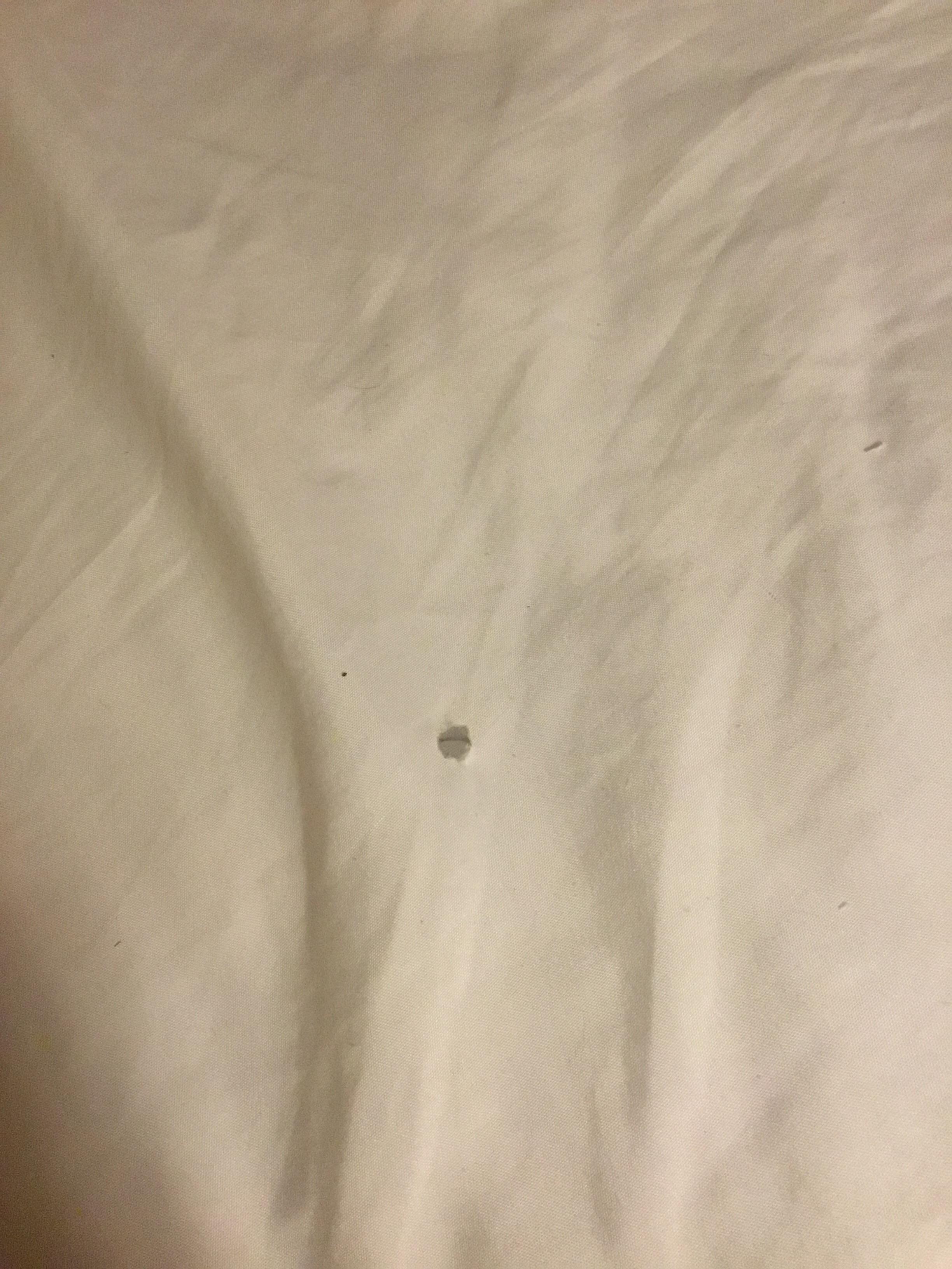Cig burn holes in non smoking room bed sheets