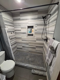 Wonderful walk in shower upstairs. One of two bathrooms upstairs.