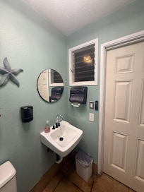 Cute poolside bathrooms for when the shower is jammed up.