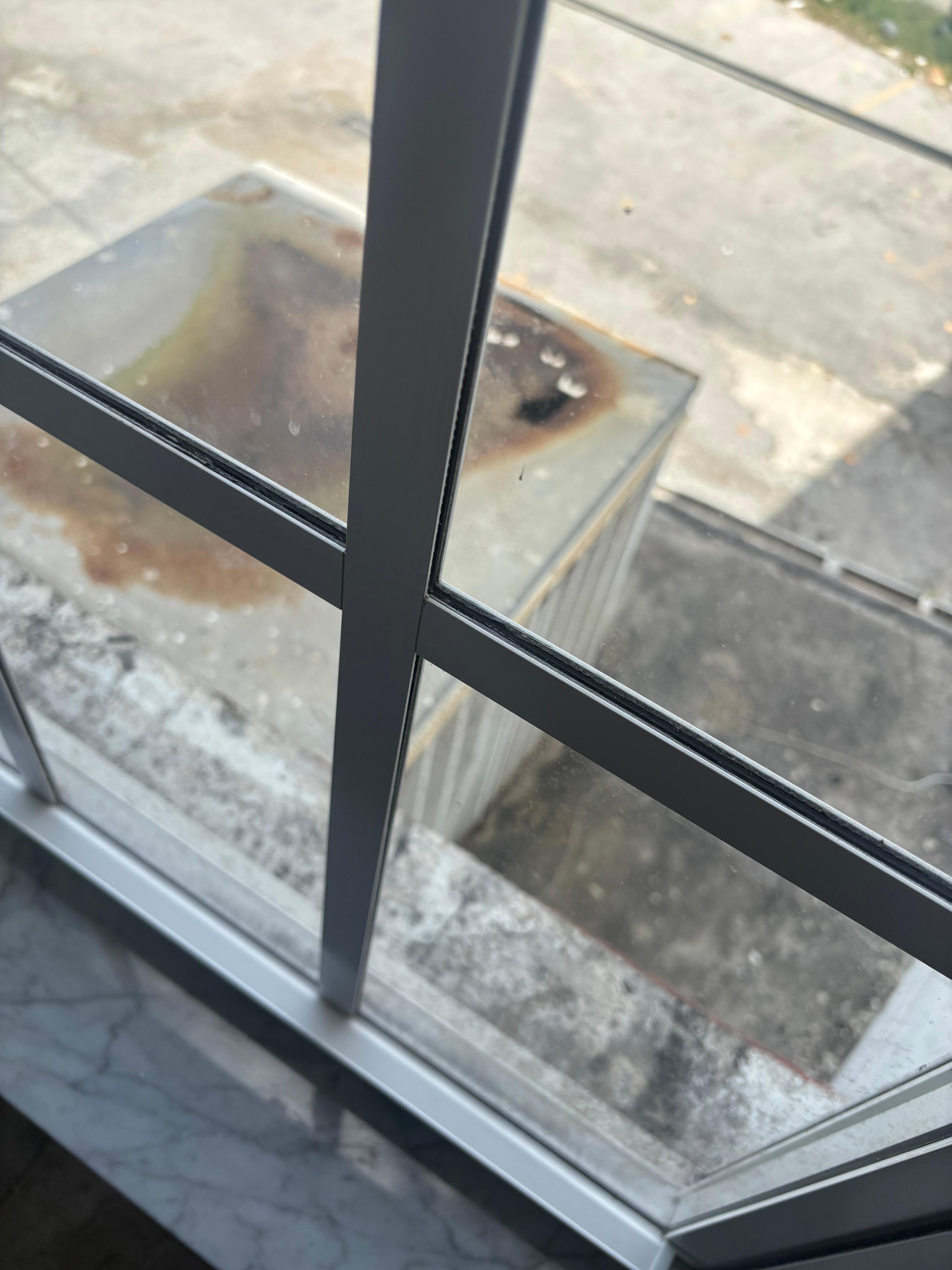 Dingy outside of building from room