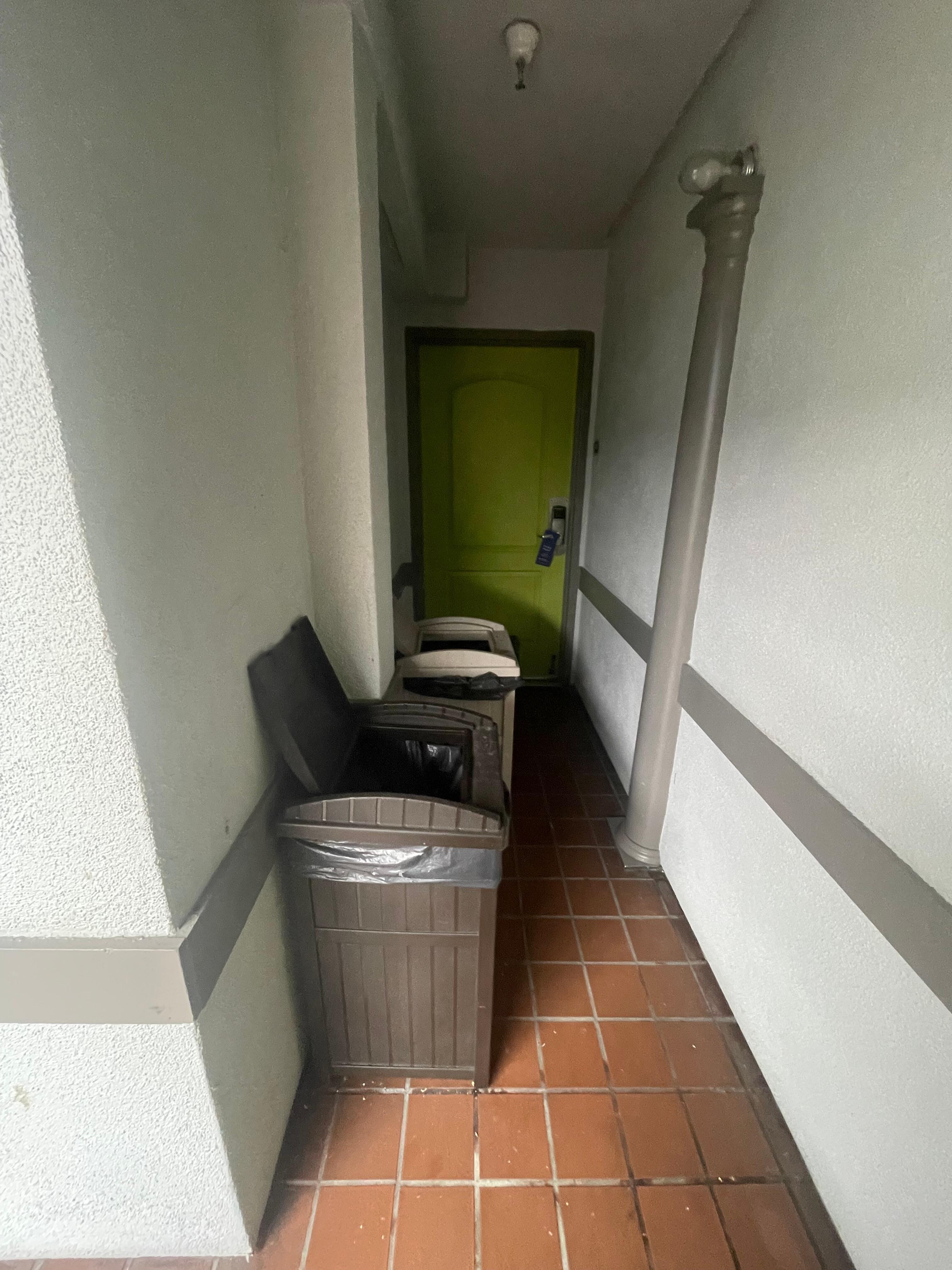 open garbage cans in front of room