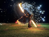 BBQ buffet with a fire show on the beach