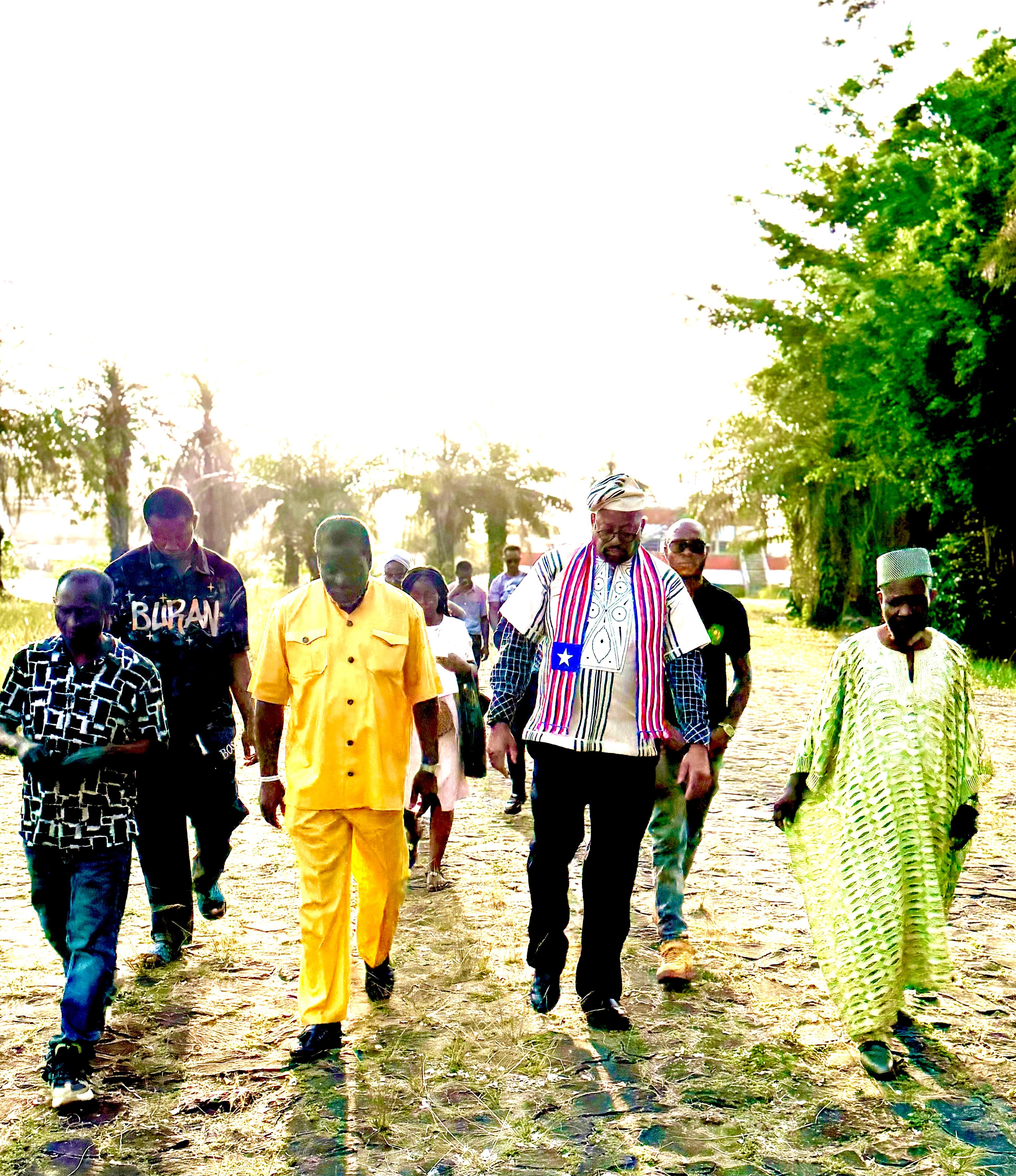 International Coach ALI walk with his Team from AUTC a Liberian Company in Providence Island