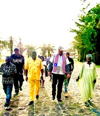 International Coach ALI walk with his Team from AUTC a Liberian Company in Providence Island