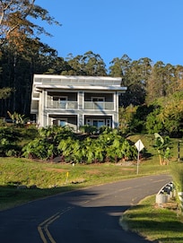 house sits by itself on a hillside