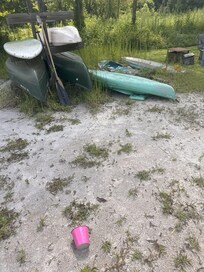 This is the supposed sandy beach and the weed covered kayaks. We had called ahead to ensure we had kayaks to use.