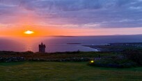 Sunset over Doonagore Castle.