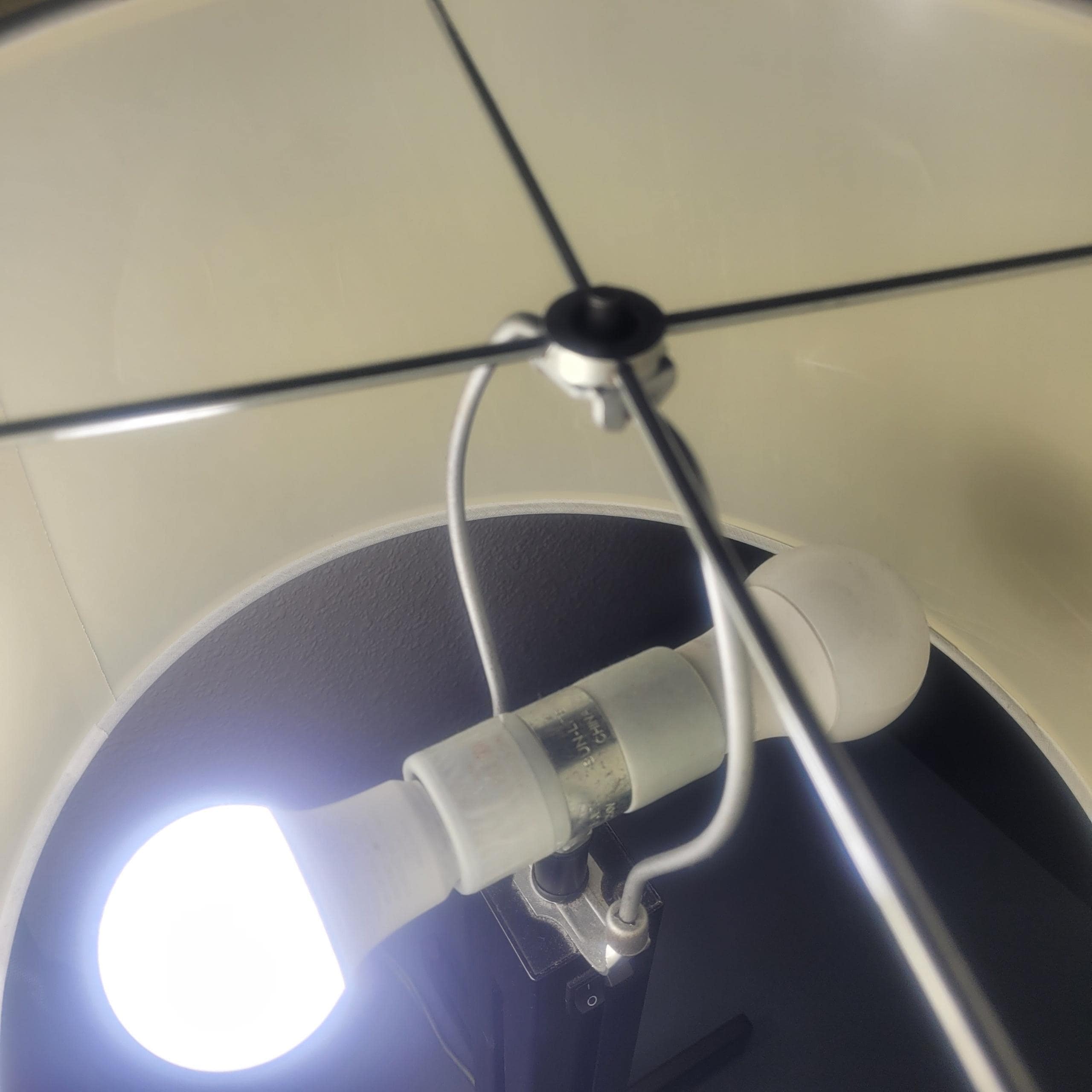 There was only one lamp in the room with only one bulb in it.