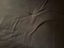 Black futon -full bed in bunk room.