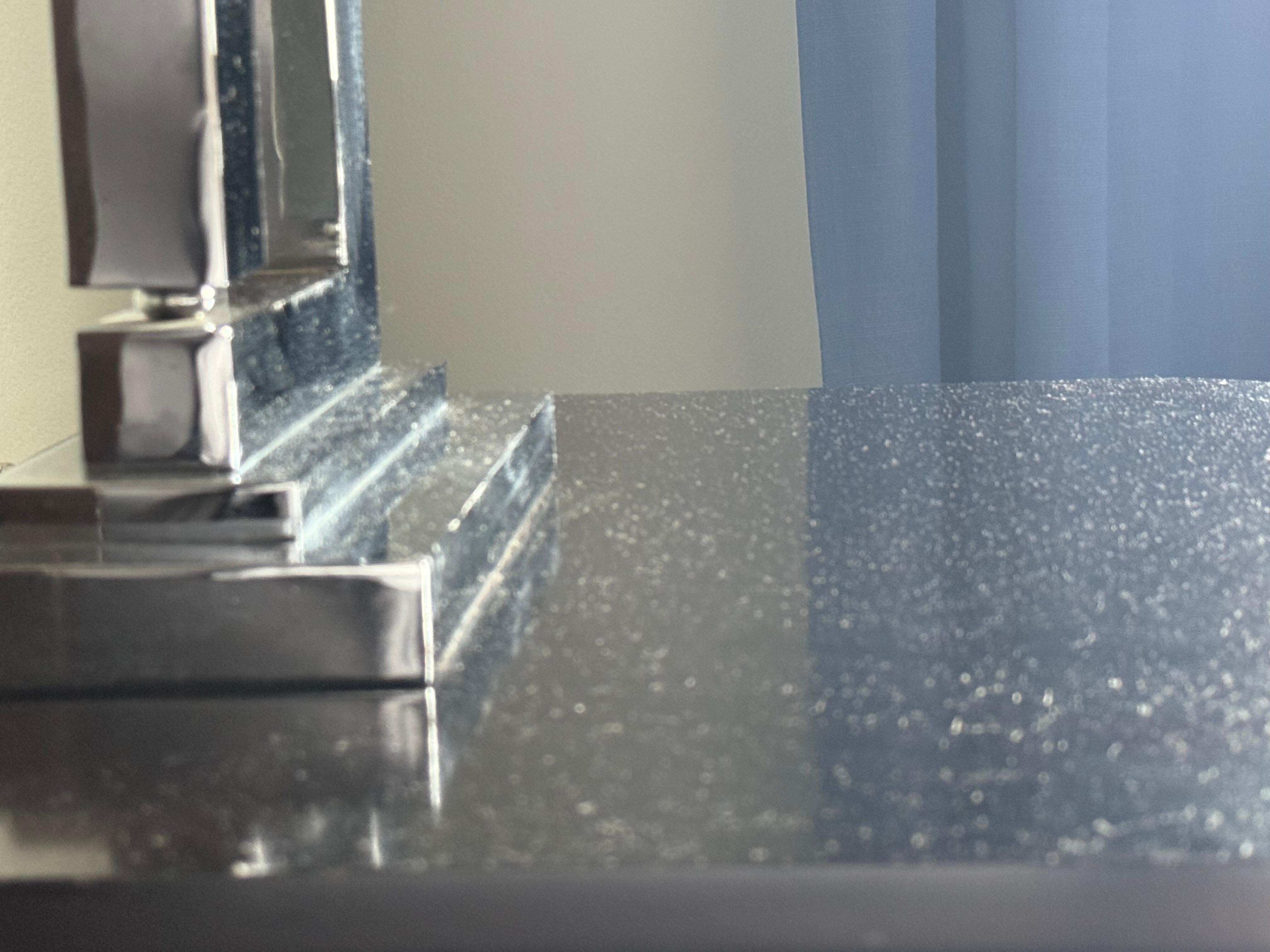 Dust build up on nightstand in Queen room