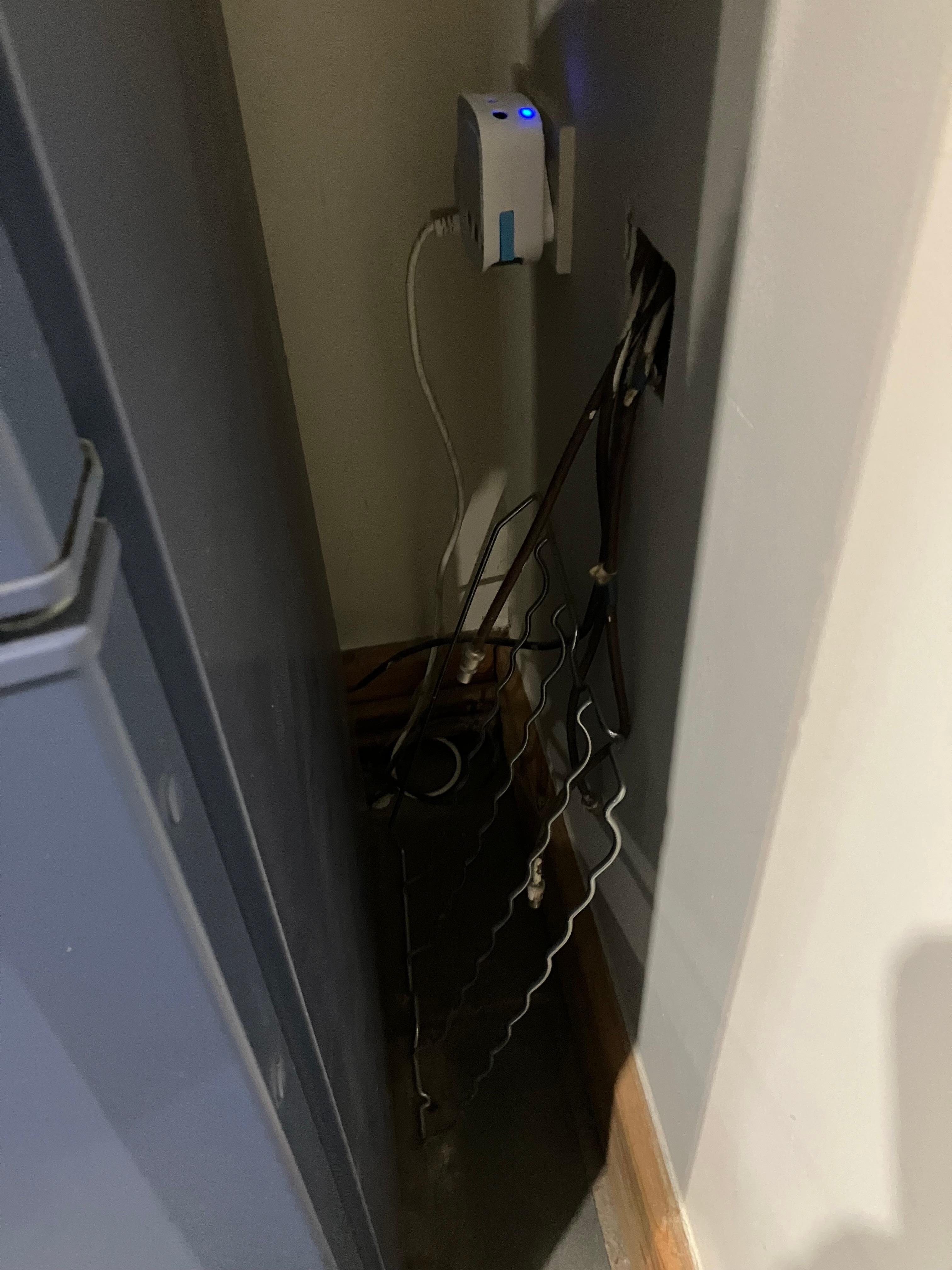 TV aerial cables coming out wall in kitchen