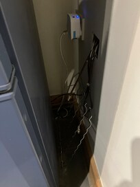 TV aerial cables coming out wall in kitchen