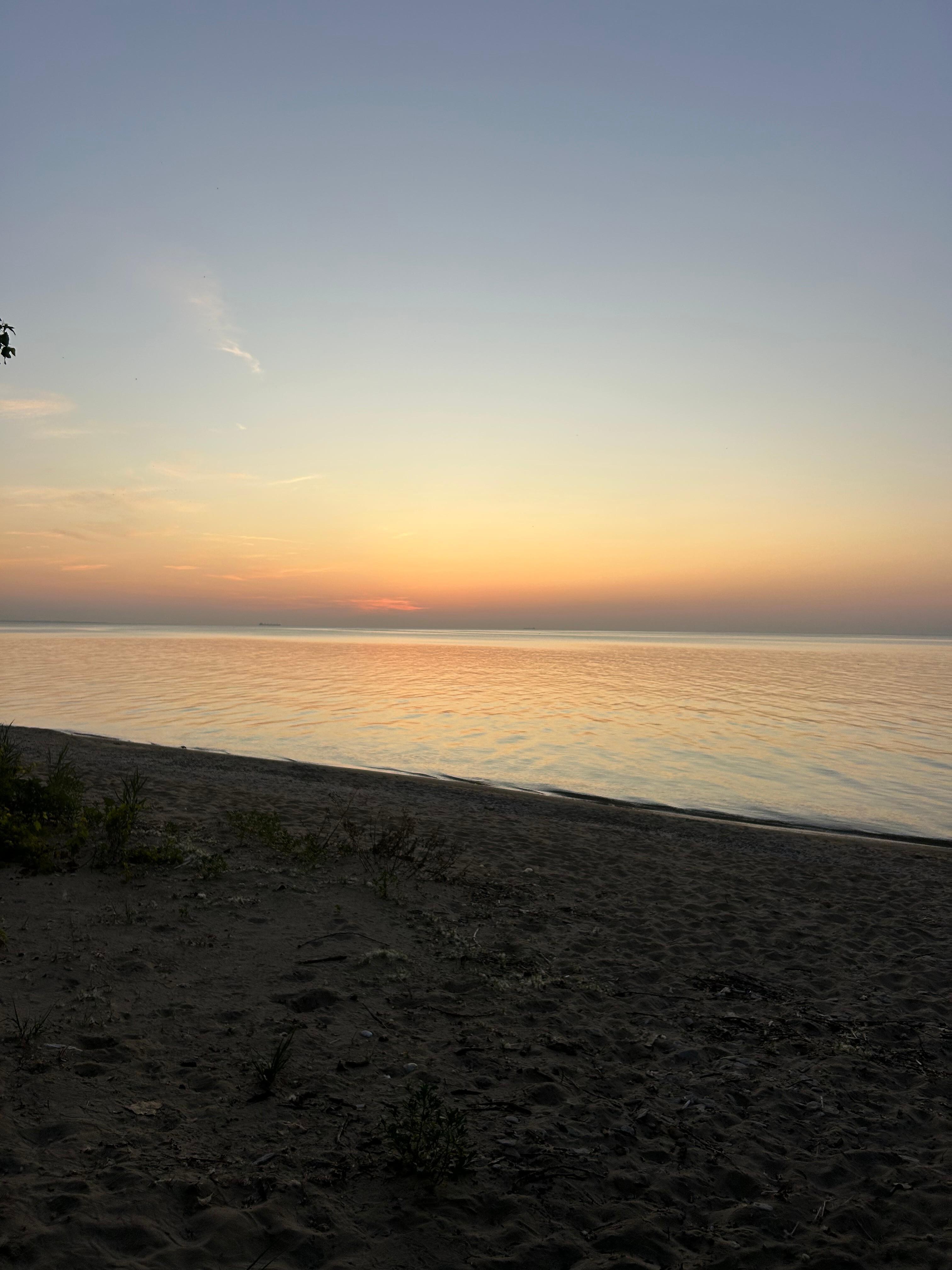 The sandy beach at sunrise. 