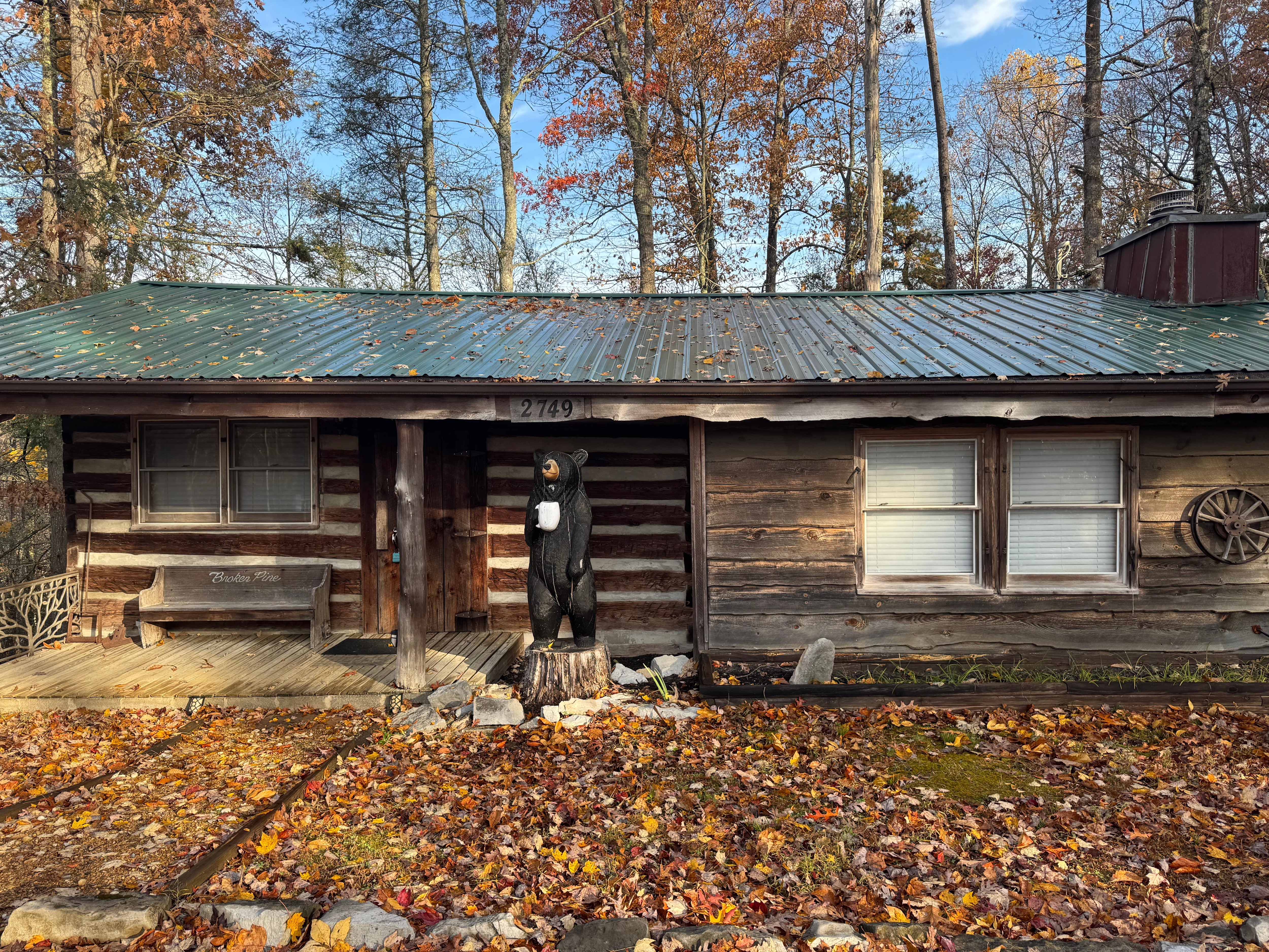 Front of the cabin with Charmin the bear.