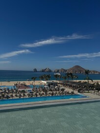 Main pool view with beach and arches