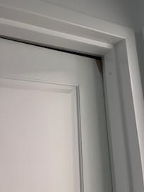 Second bedroom door- can’t shut as the top is broken and door appears to be warped