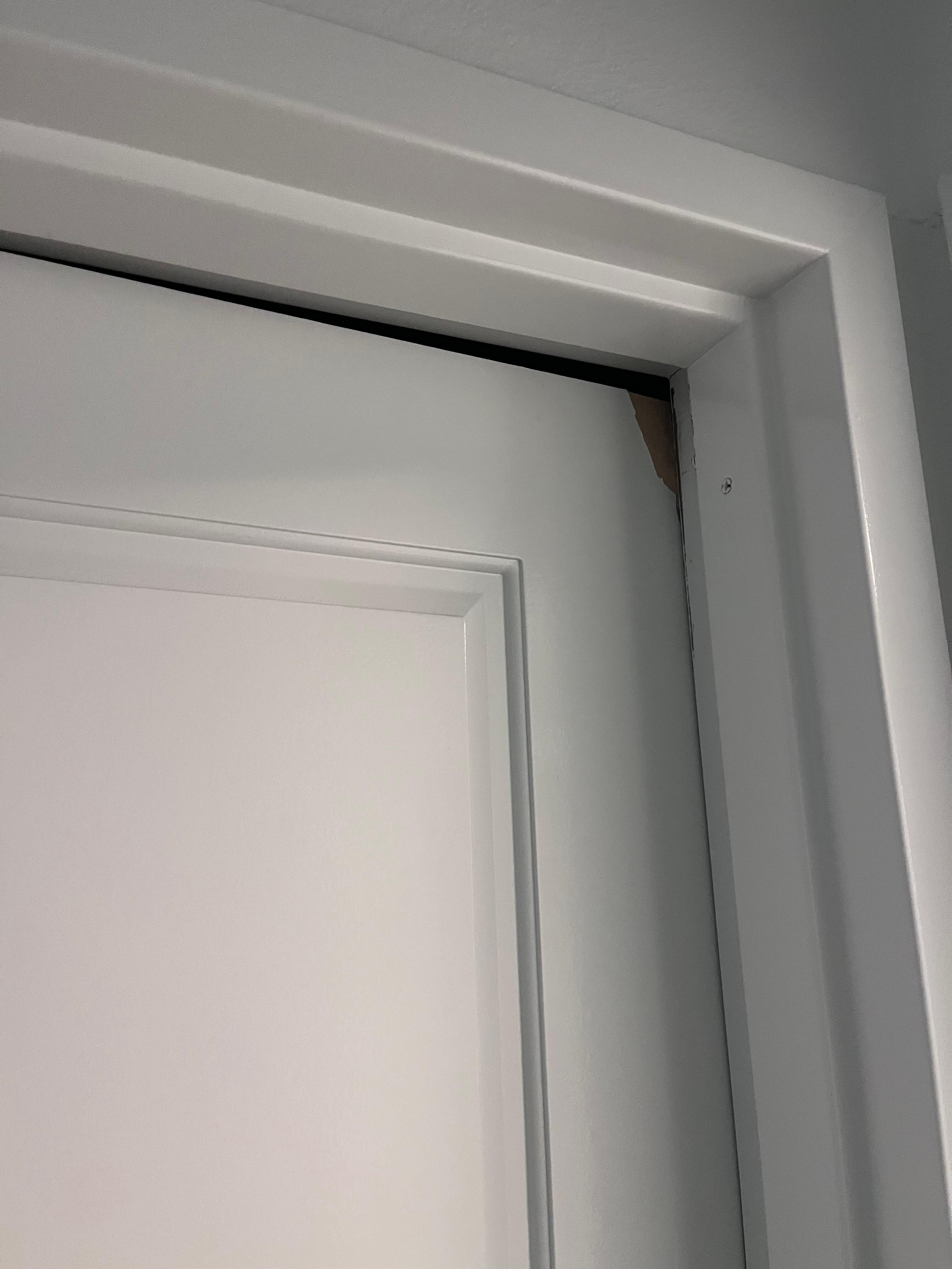 Second bedroom door- can’t shut as the top is broken and door appears to be warped 