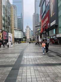 The entrance to the square around the Hotel every imaginable thing goes on here very crowded all day long covers 2 blocks at least center around the People’s Liberation Monument one of many around the country.