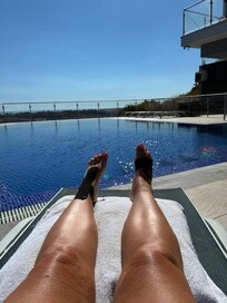 sun tanning by the fabulous pool