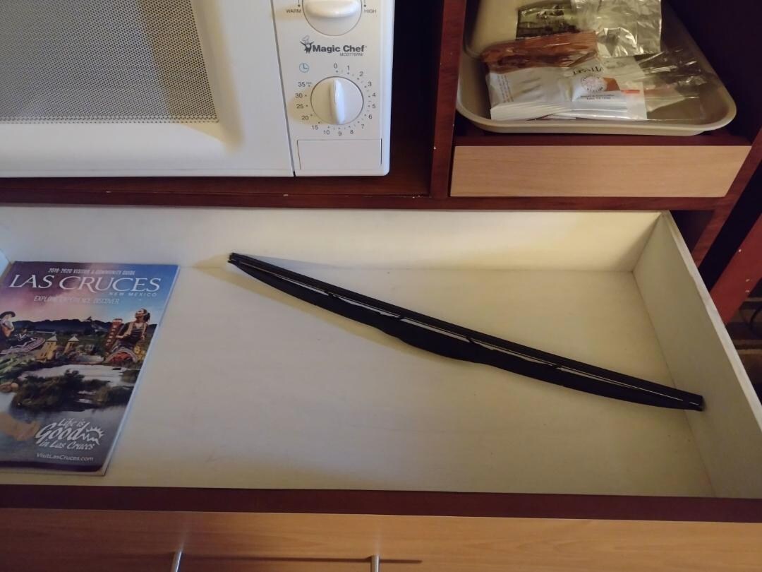 Windshield wiper in drawer (?) No cups or glasses in the room