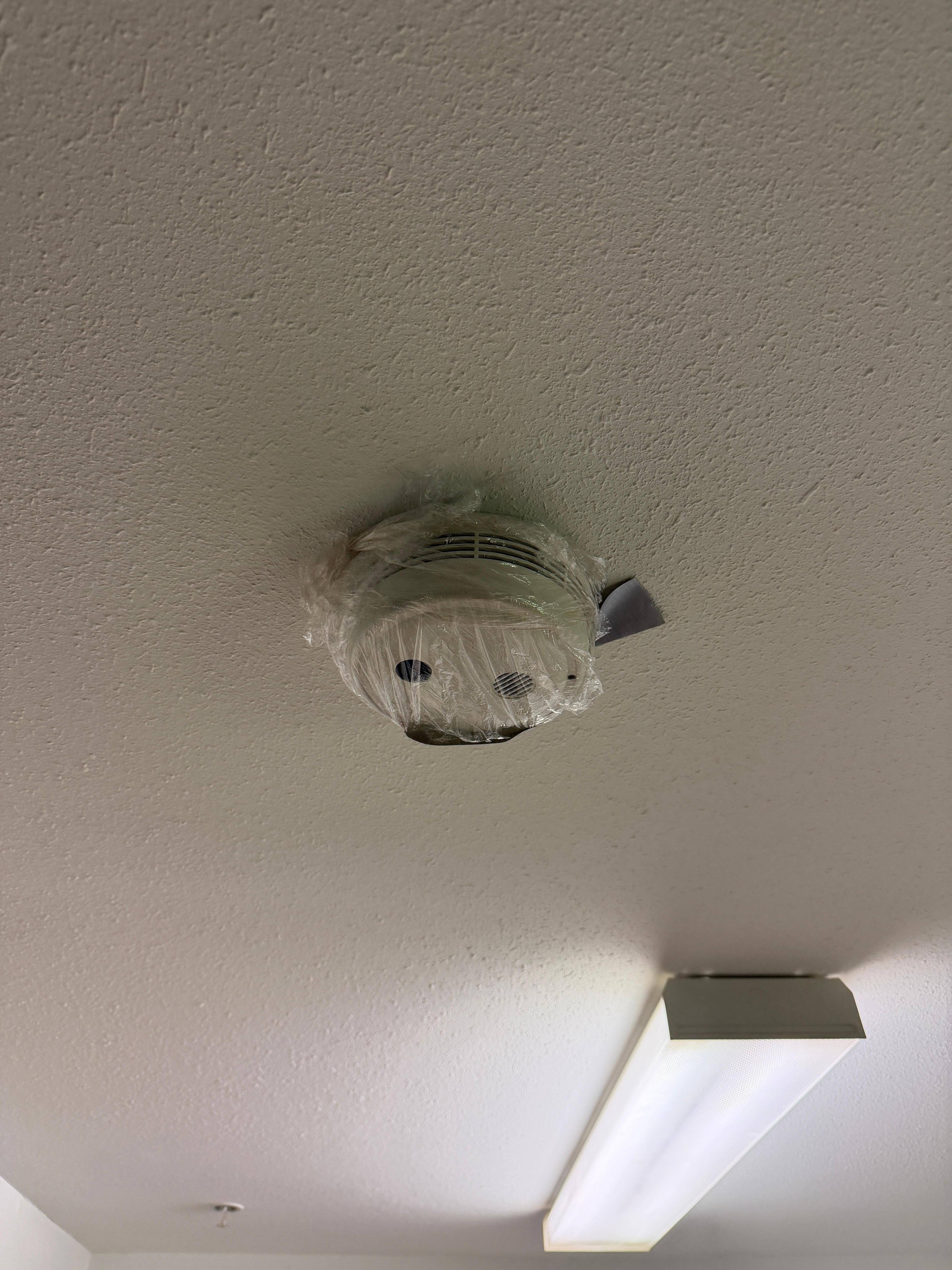 Fire alarm covered by plastic 