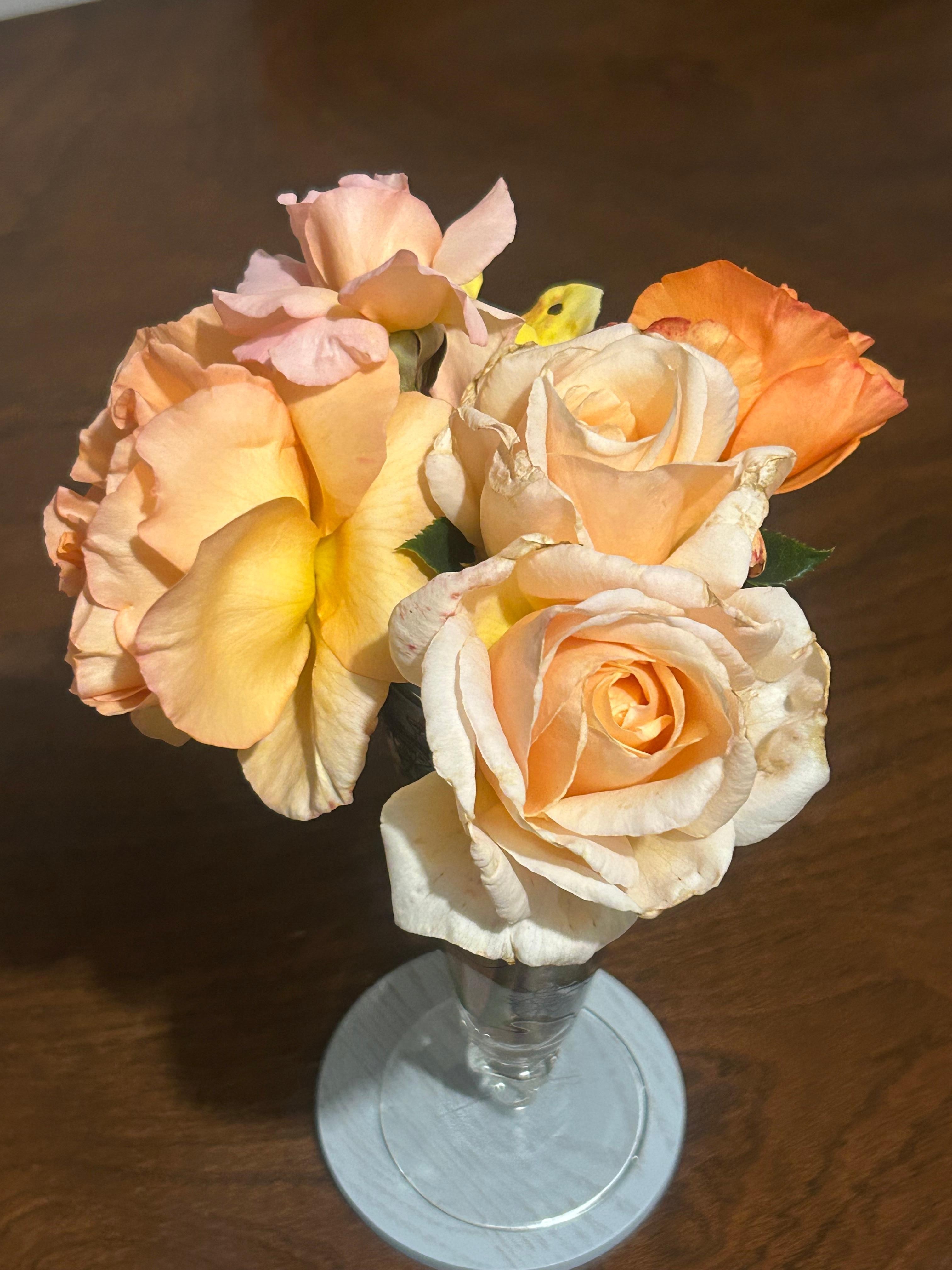Beautiful scented roses on the dining table.