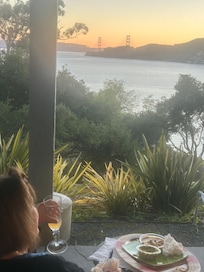 Me relaxing on the back veranda with the Golden Gate Bridge more