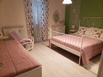 Real comfortable bed with plenty of bedding for cozy nights.