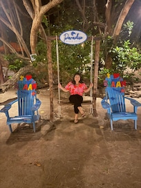 The swing in the courtyard near the pool.