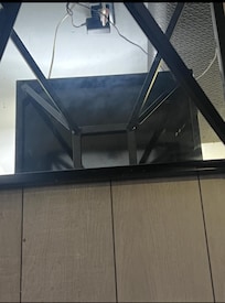 The table with the mirror not clean withe smears all over it.