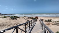 The walkway to the beach over the sand dunes