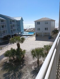 View from our patio balcony for the water and white sand