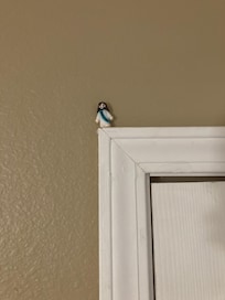 Somebody put a figurine on a door frame in the room. Who knows how long itโs been since the frames have been wiped down or dusted.