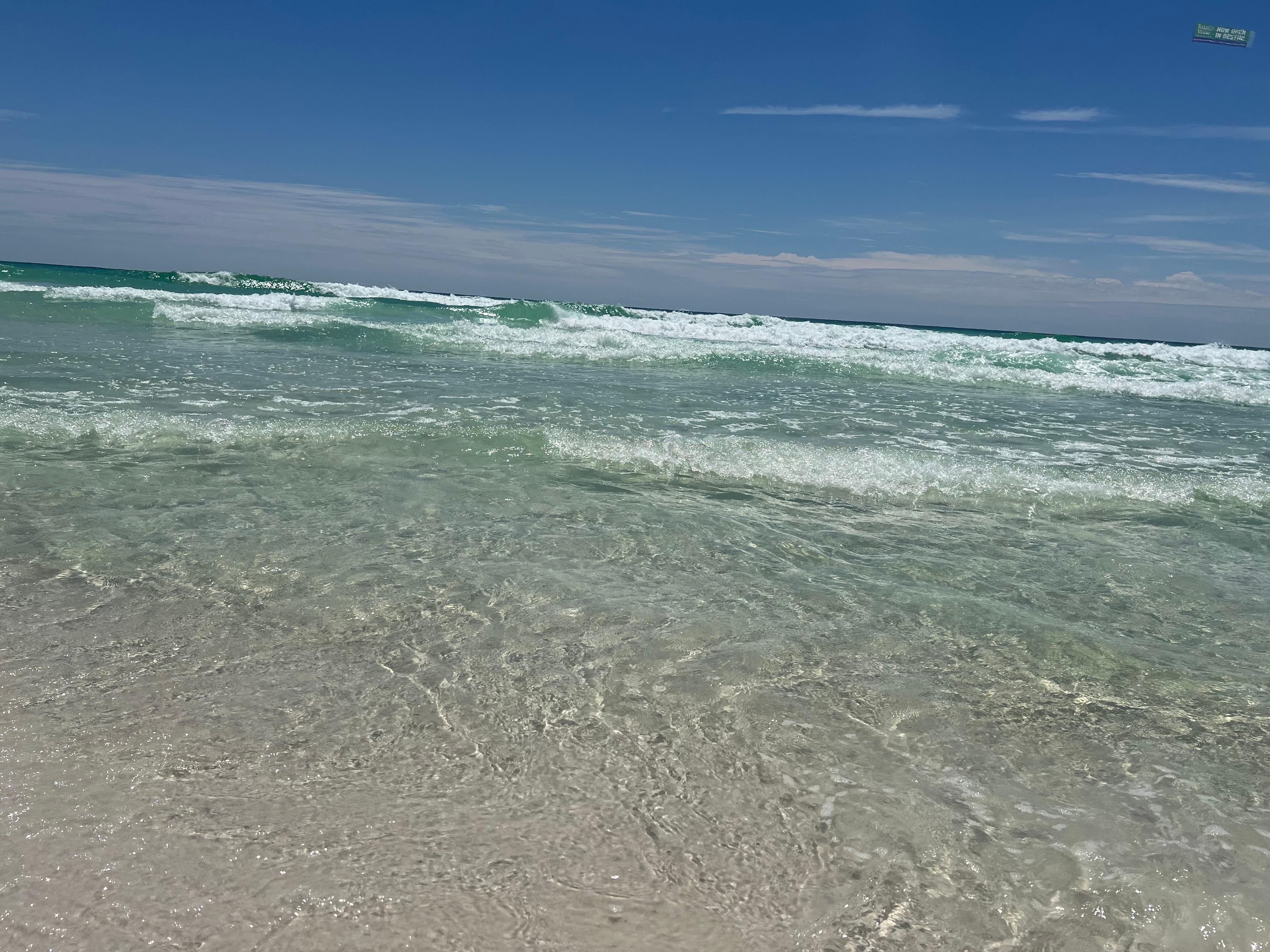 Steps from the clear, emerald waters of the Gulf 