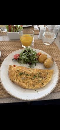 Omelette with salad and baked potatoes.