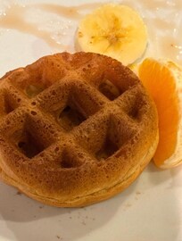 Yummy waffle for breakfast with some fruit.