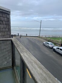 Private balcony on third floor. The river and ocean were mesmerizing to watch. There are two Adirondack chairs out there.
