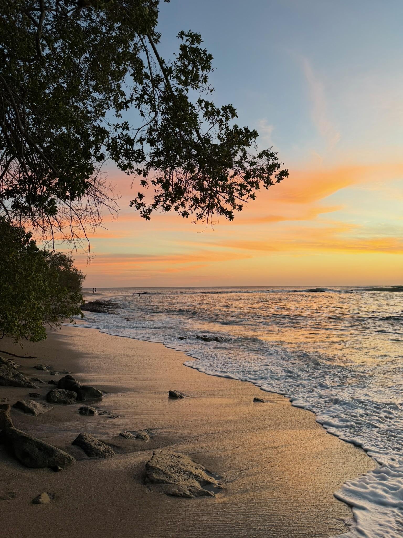 Beach close to high tide at sunset