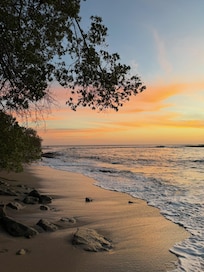 Beach close to high tide at sunset