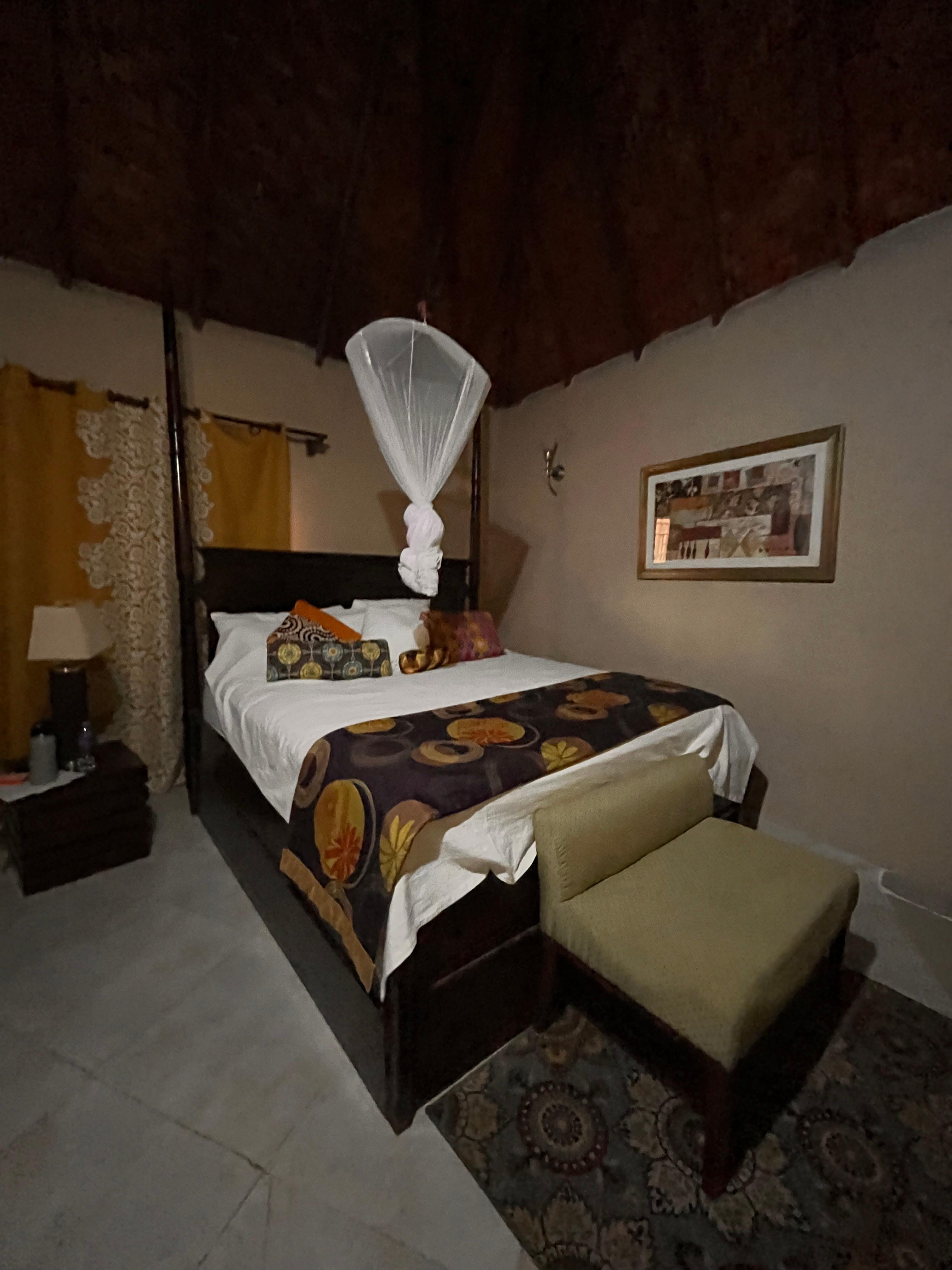 One of two beds in-suite with mosquito net