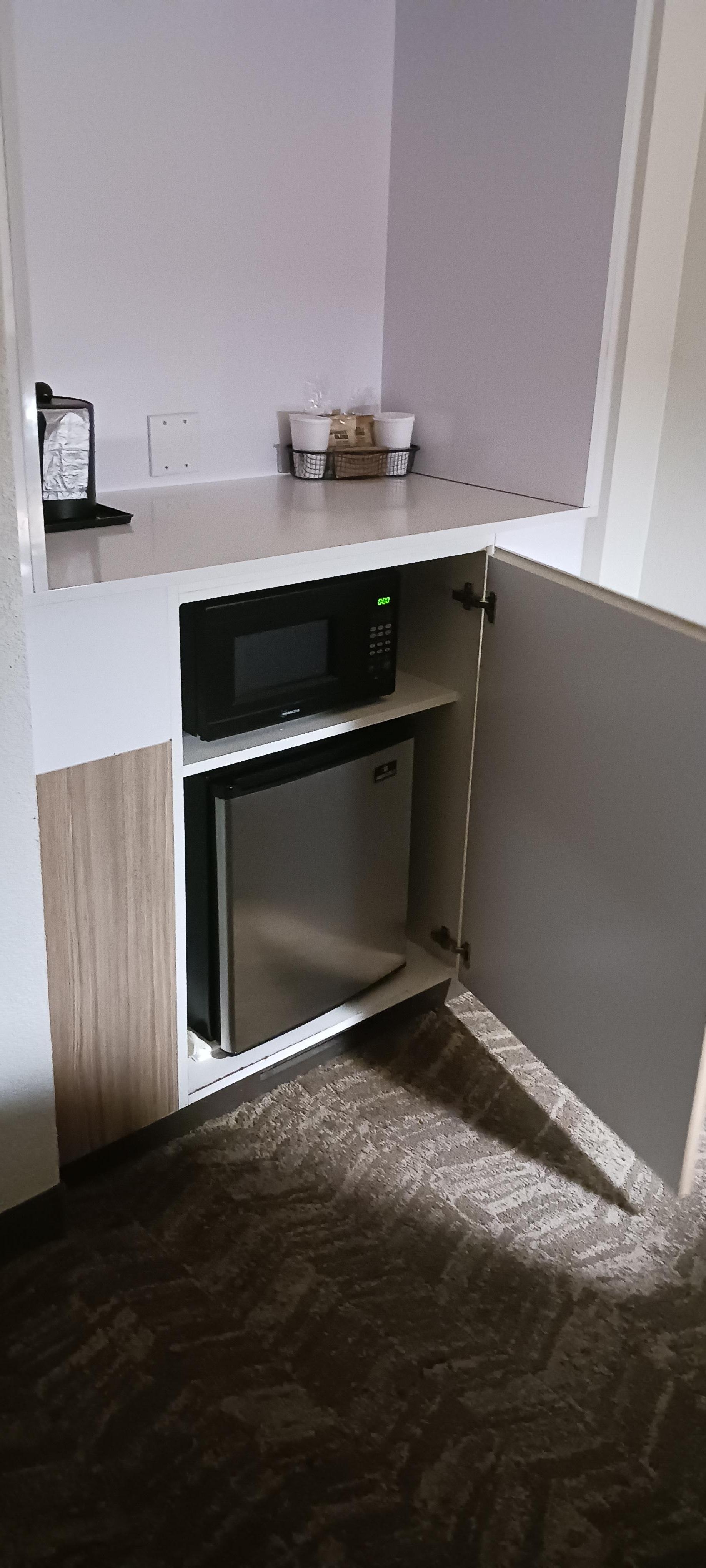 Mini fridge and microwave 
Coffee pot and coffee