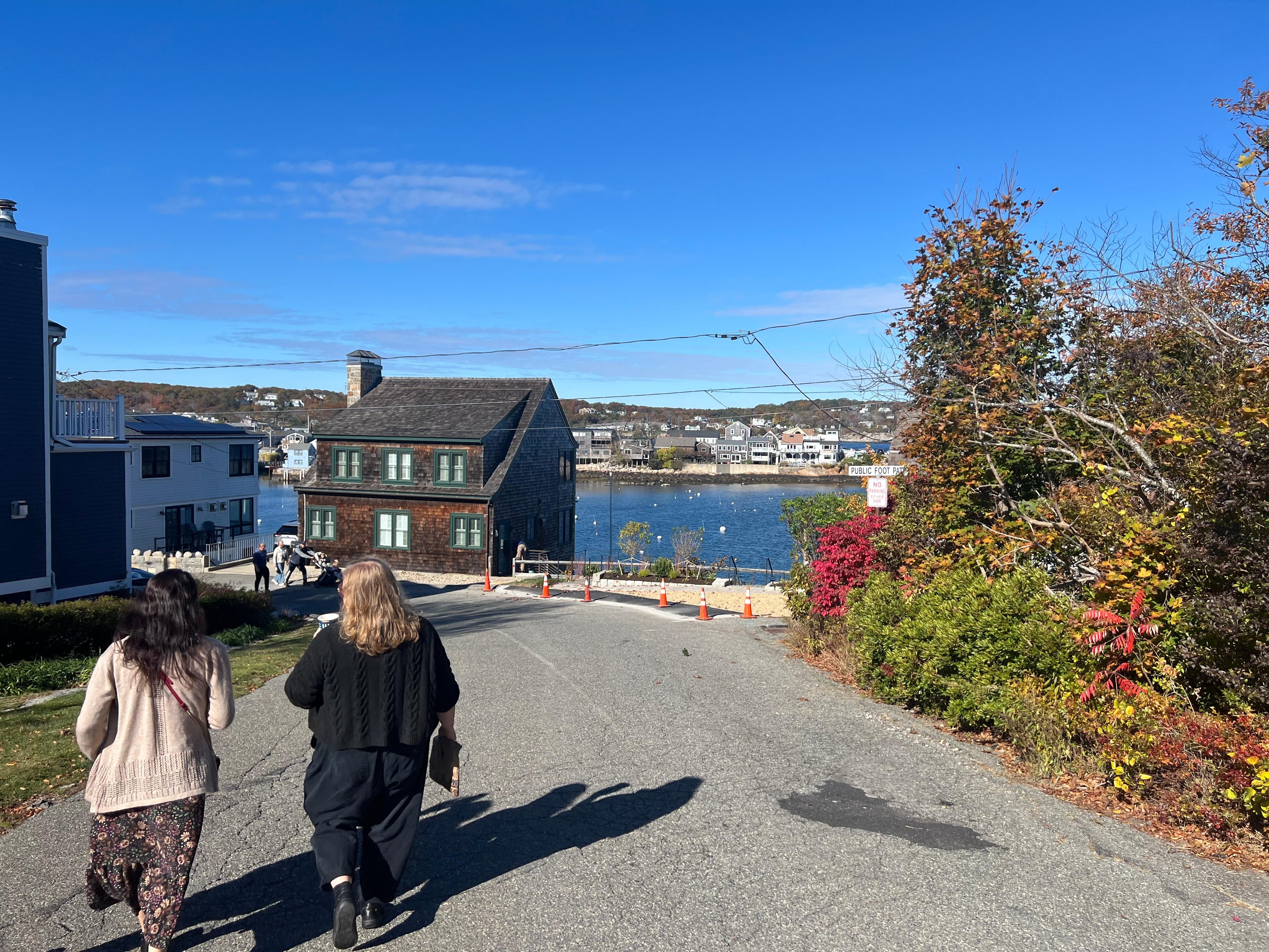 Walking from the house to the shopping area, with a beautiful view and a walking path to the right. 