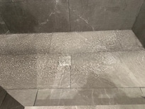 2 to 3 inches of standing water in the clogged slow draining shower stall