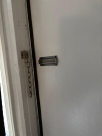 Door that opens out, not in and the missing lock.