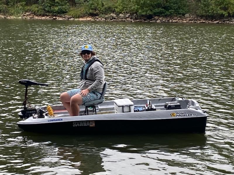 Grandson enjoying his new boat