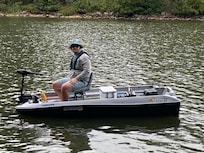Grandson enjoying his new boat